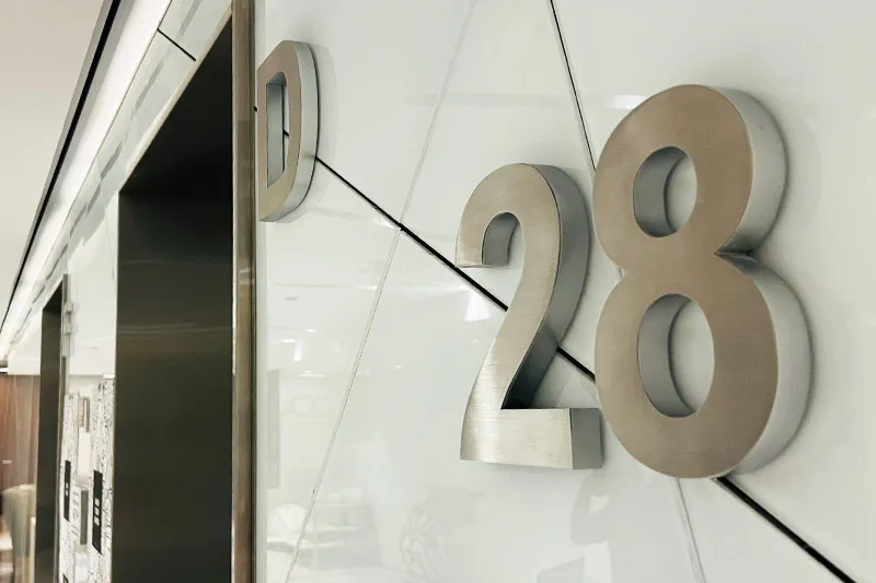 Signage, numbering plates